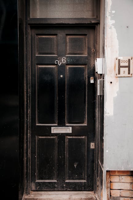 Classic black door with number twenty-six symbolizing entry to innovation